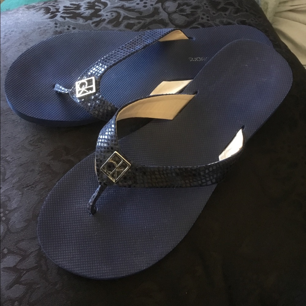 Cute blue CK flip flops size 8.